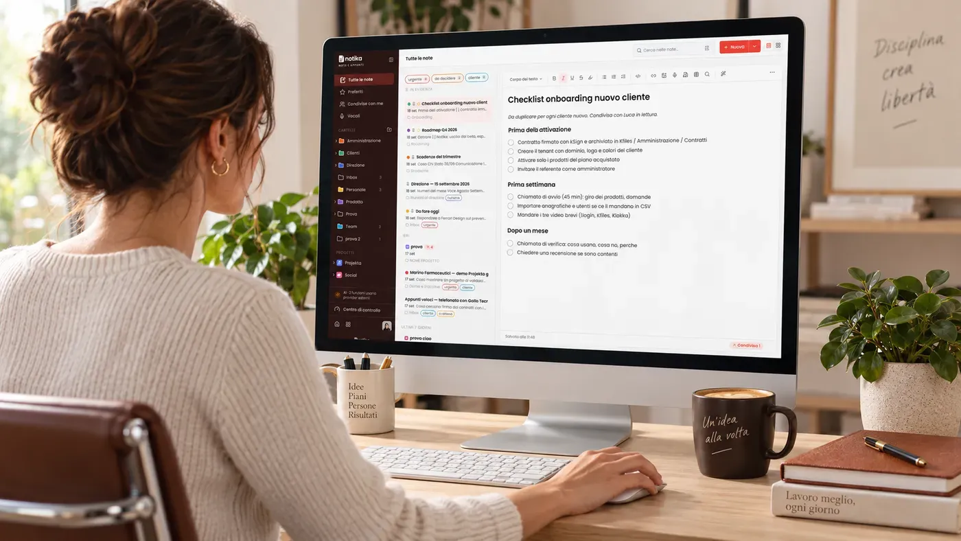 Person at a desk with Notika open on the monitor: the notes list on the left and a client onboarding checklist in the editor